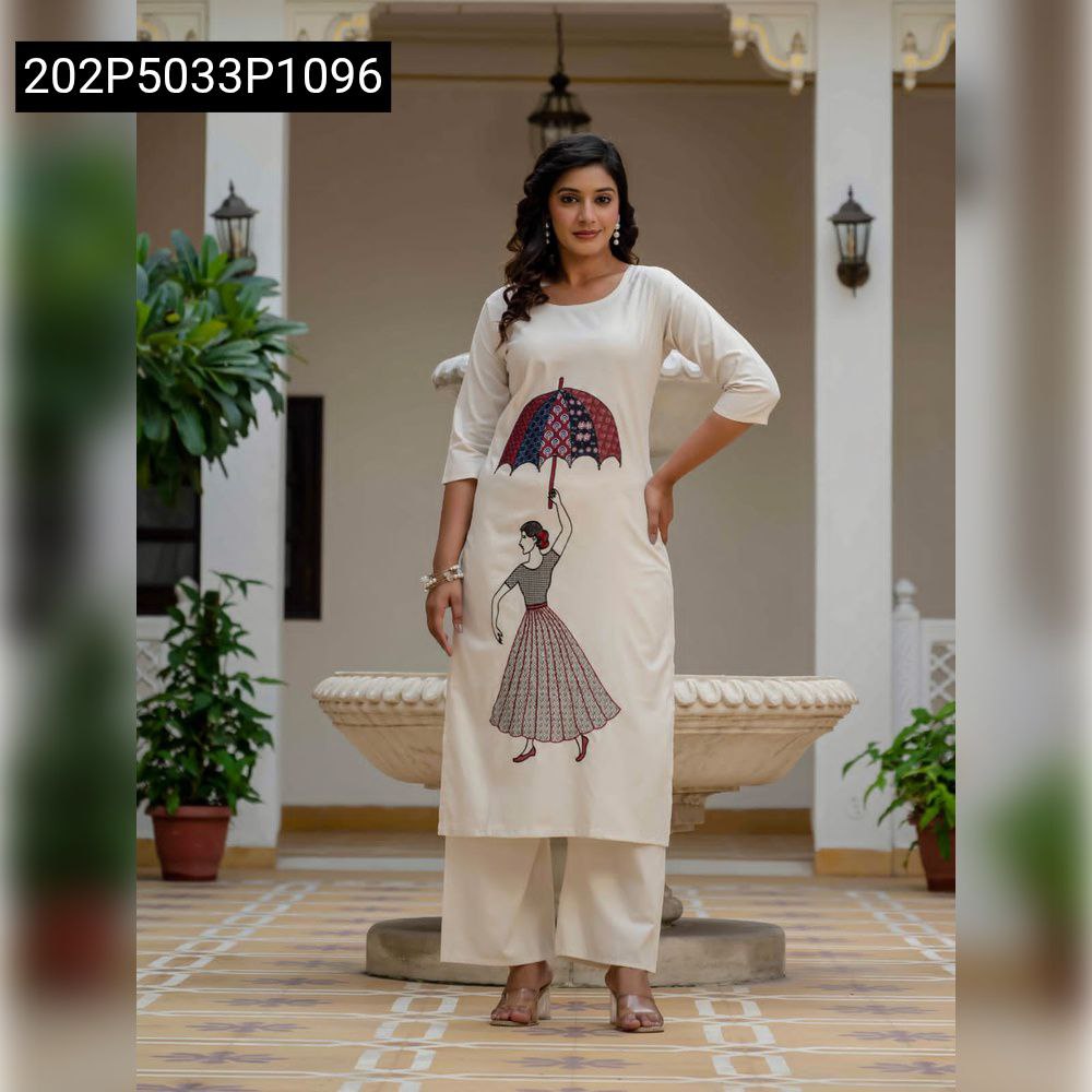 Full body model posing in a cream Khadi Cotton suit set with an umbrella-girl embroidery design.