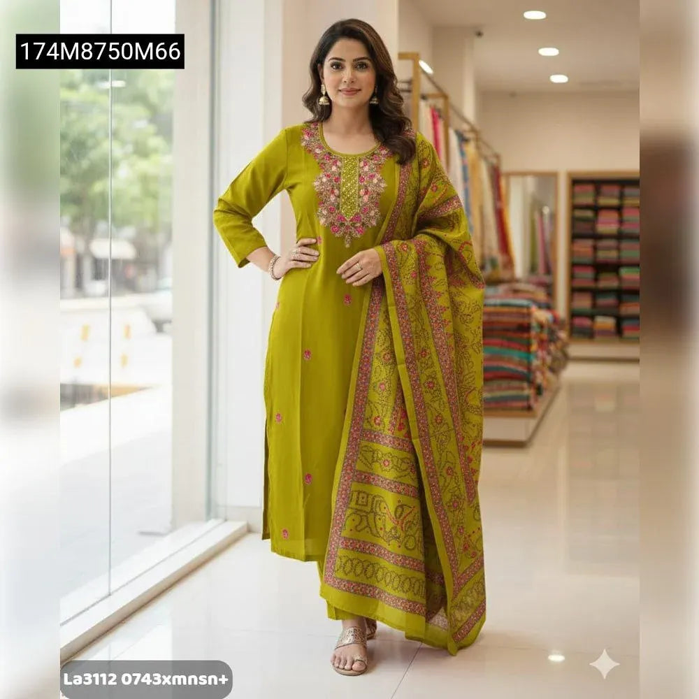 Woman showcasing TRENDBUY's Olive Green Maslin Silk Kurti Set with intricate koding work embroidery, elegant pants, and a uniquely patterned dupatta, standing front-on.