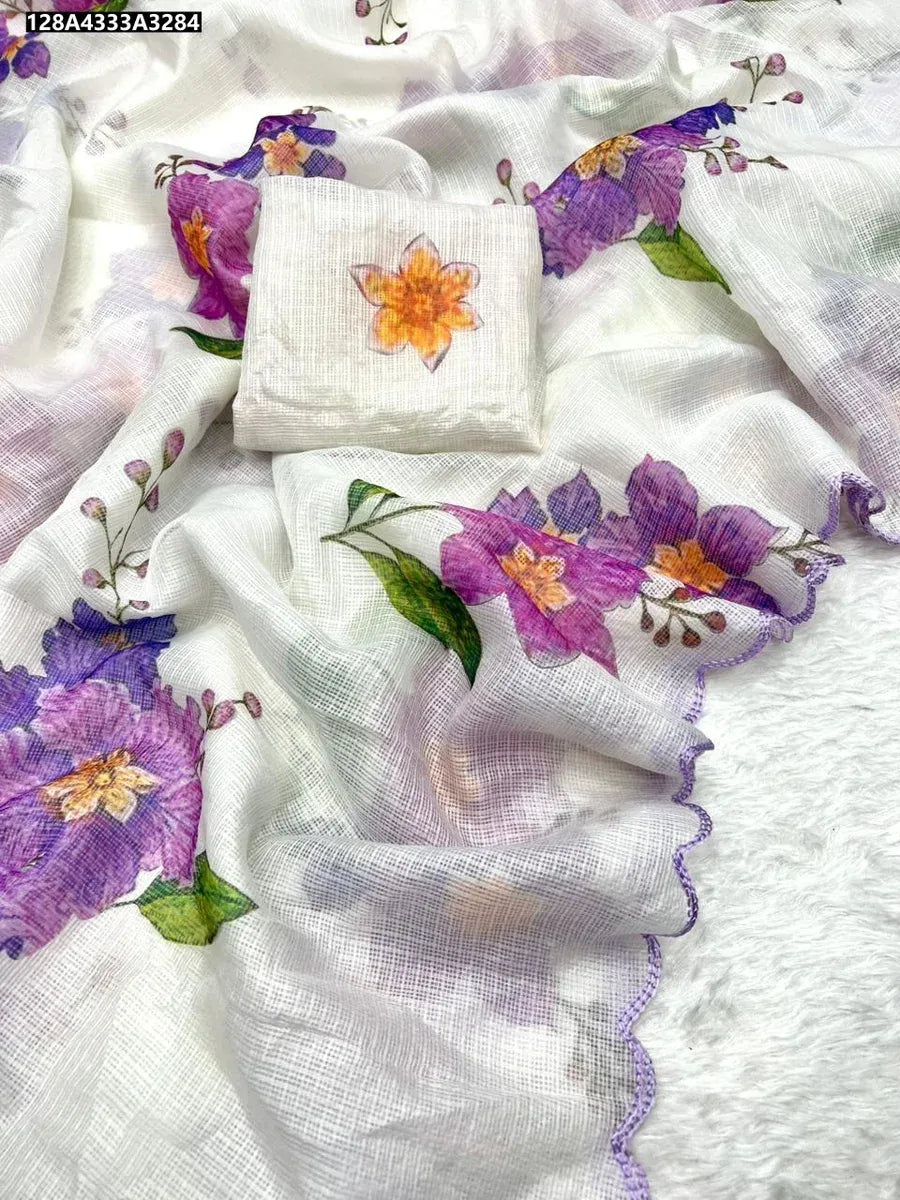 Kota Silk Saree in white with purple and orange floral print, cut work border, and matching blouse piece on a white textured background.