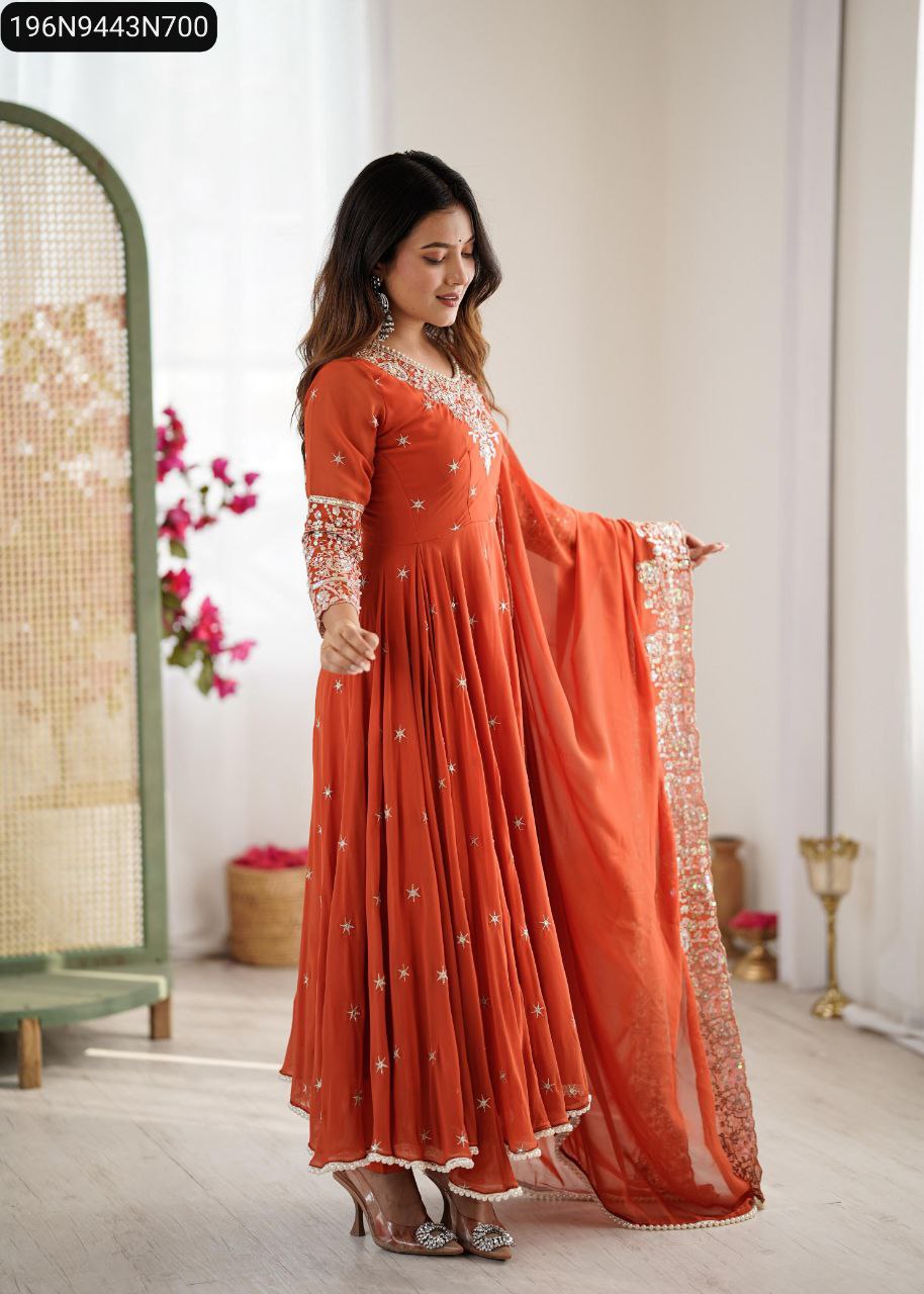Model in Terracotta Orange Anarkali Gown, sophisticated side pose with dupatta draped elegantly