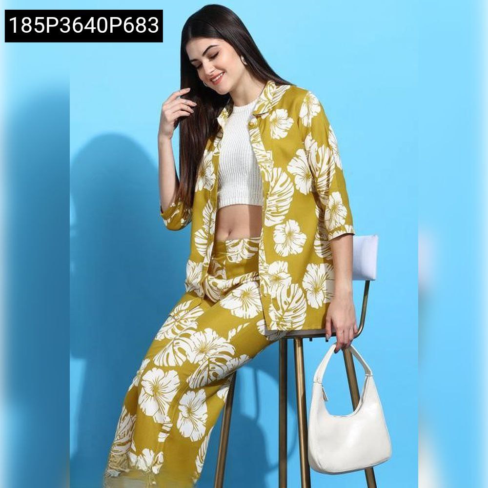 Woman in Mustard Yellow Floral Rayon Palazzo Set, posing elegantly.