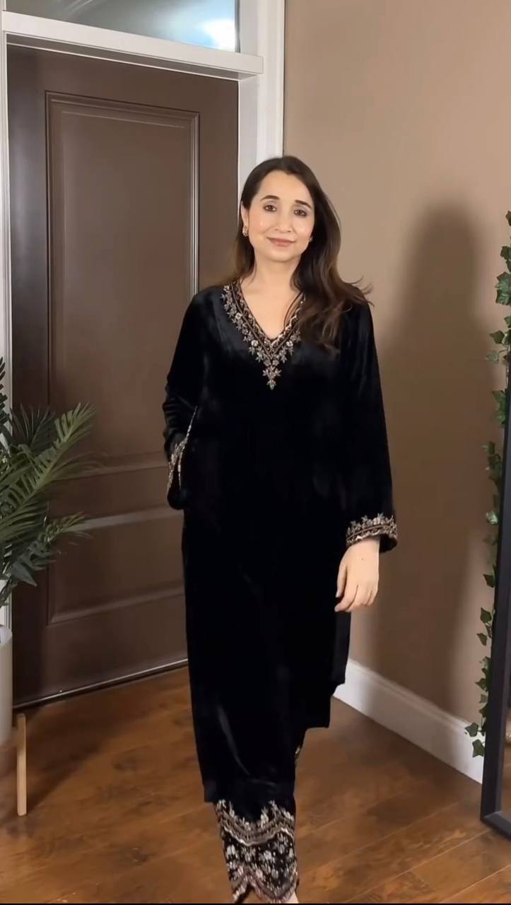 Full body shot of model wearing elegant black Viscos Velvet Kurta Pant Set with intricate thread and sequin embroidery, front view.