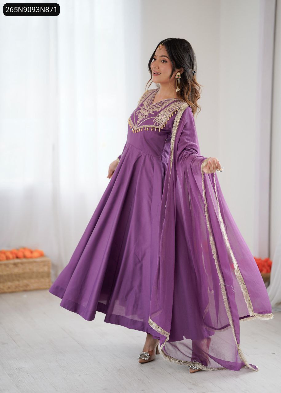 Model posing in a flowing Lavender Anarkali Gown Set with intricate gold embroidery and a matching dupatta.