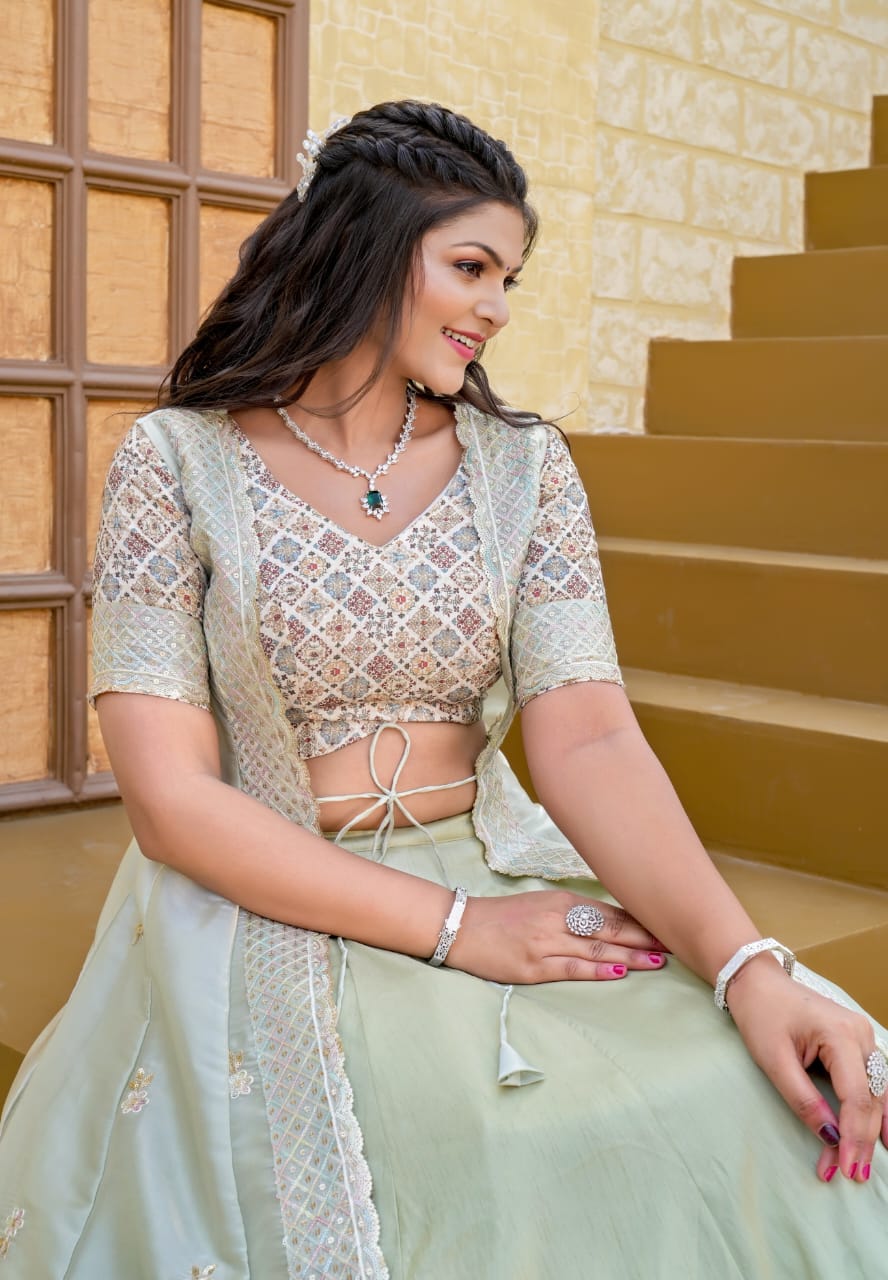 Model in Pista Green Butterfly Shrag Indo-Western Lehenga, showcasing intricate blouse and jacket embroidery.
