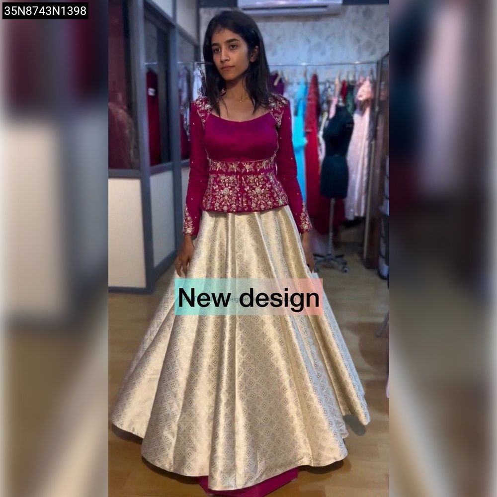 Full-front view of model in TRENDBUY's Magenta Gold Embroidered Peplum Lehenga, showcasing intricate work.