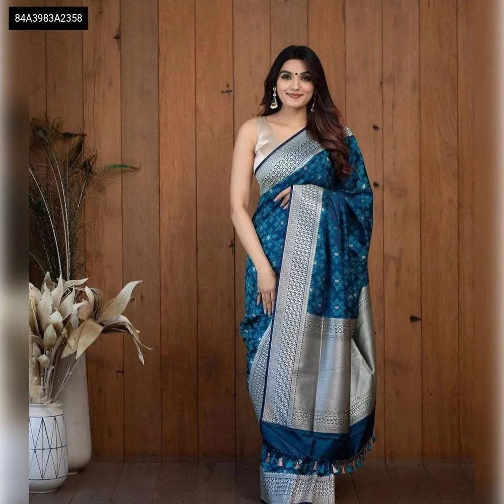 Front-facing model showcasing TRENDBUY Lichi Silk Jacquard Saree in teal blue, elegant drape, looking at camera.
