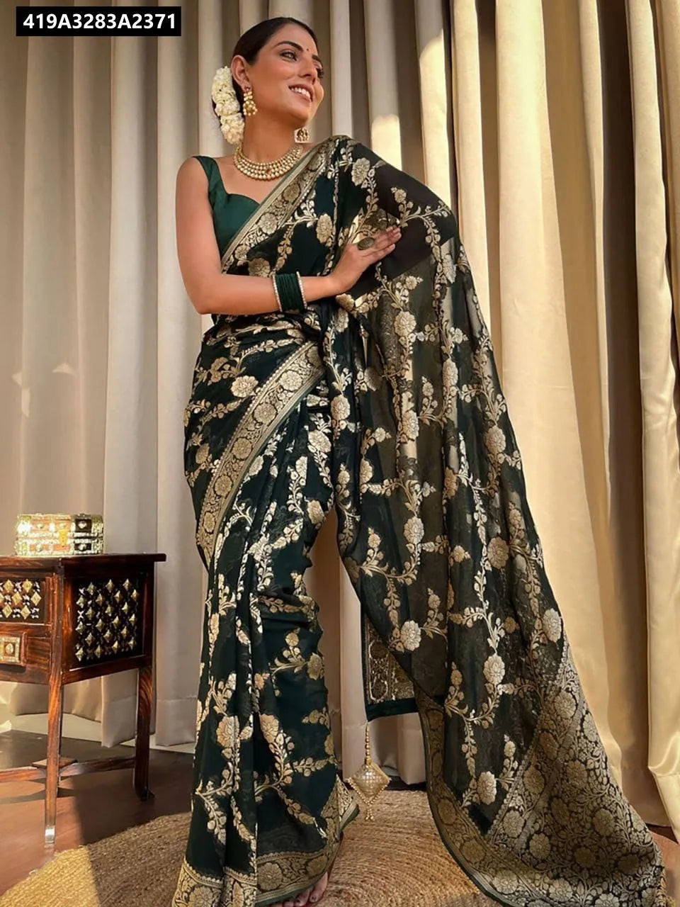 Model wearing a beautiful Emerald Green Lichi Silk Jacquard Saree with golden motifs.
