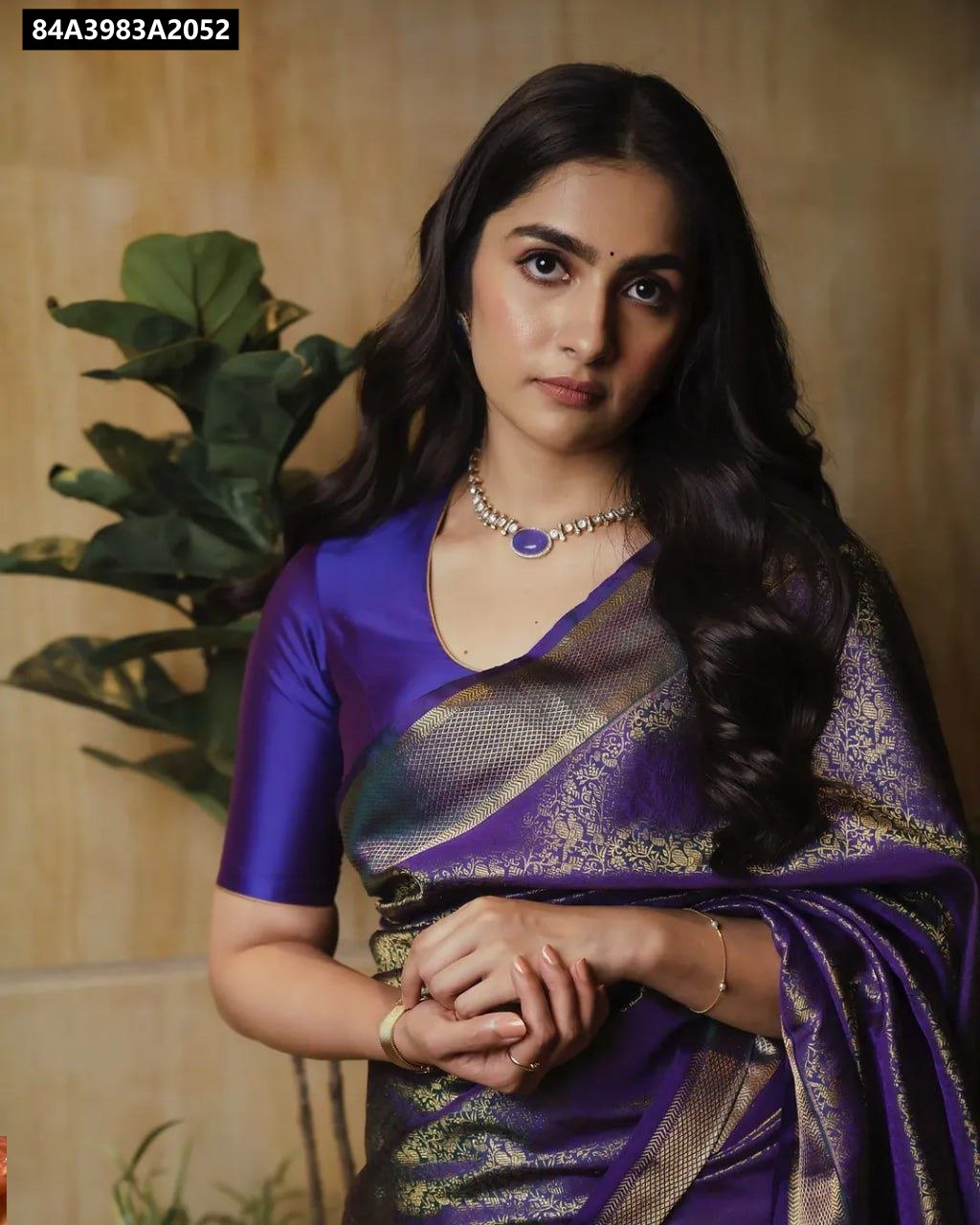 Woman in royal purple Lichi Silk Jacquard Saree with rich pallu and intricate work, front-facing. TRENDBUY Festive Saree.