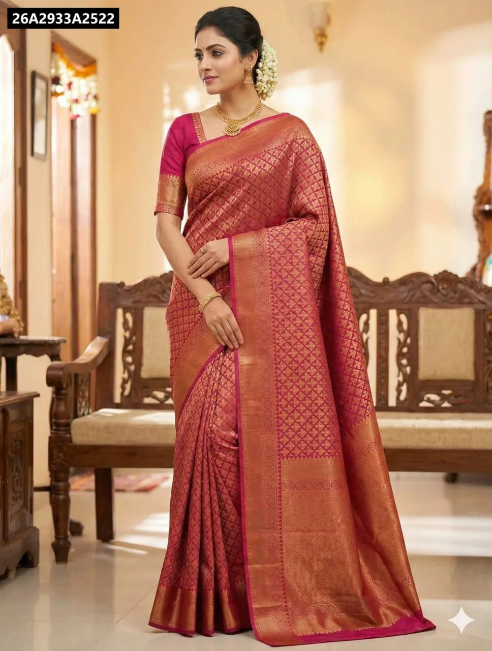 Woman standing in Berry Pink Lichi Silk Saree, showcasing rich pallu and full drape.