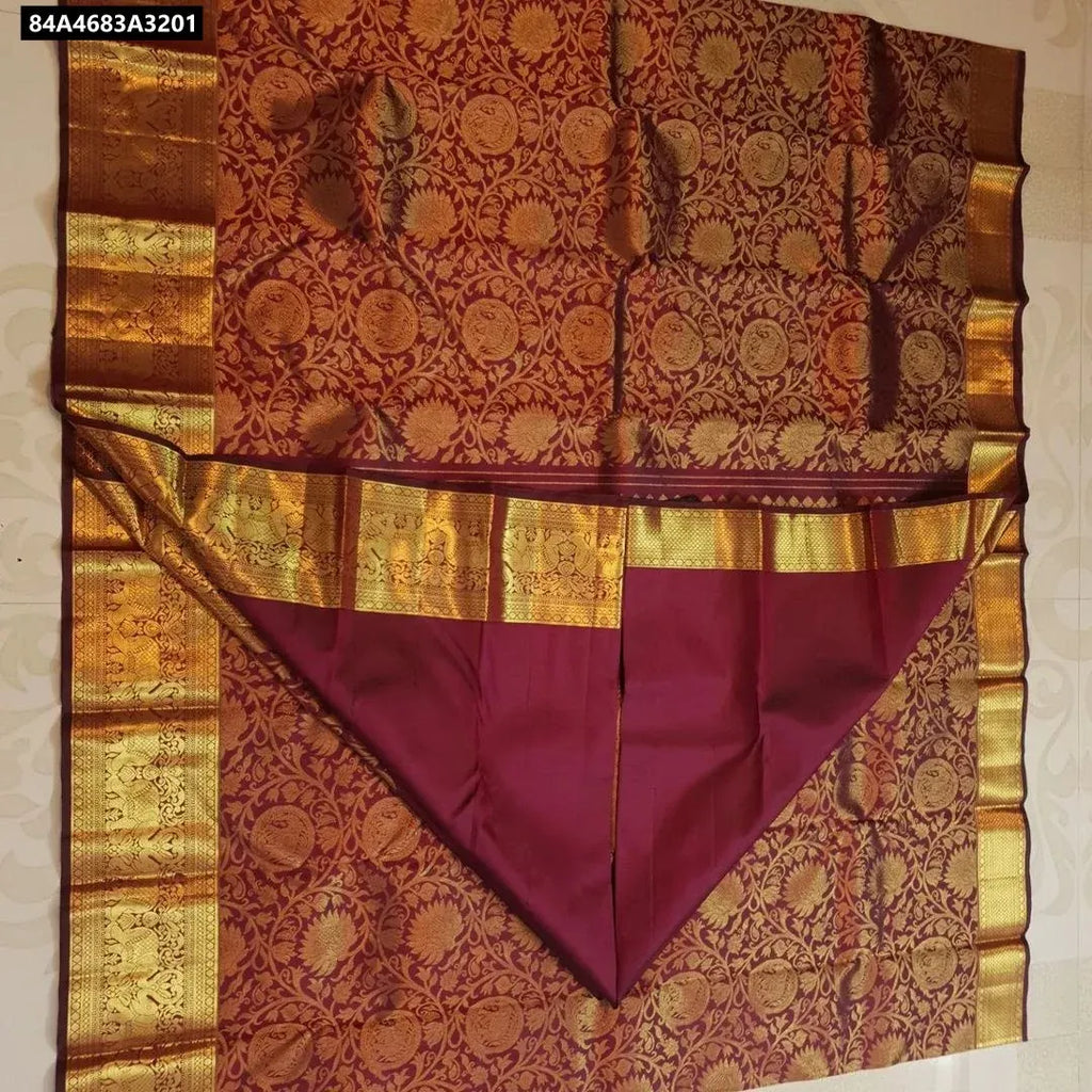Flat lay of TRENDBUY Maroon Lichi Silk Saree showcasing the rich pallu and full jacquard body design.