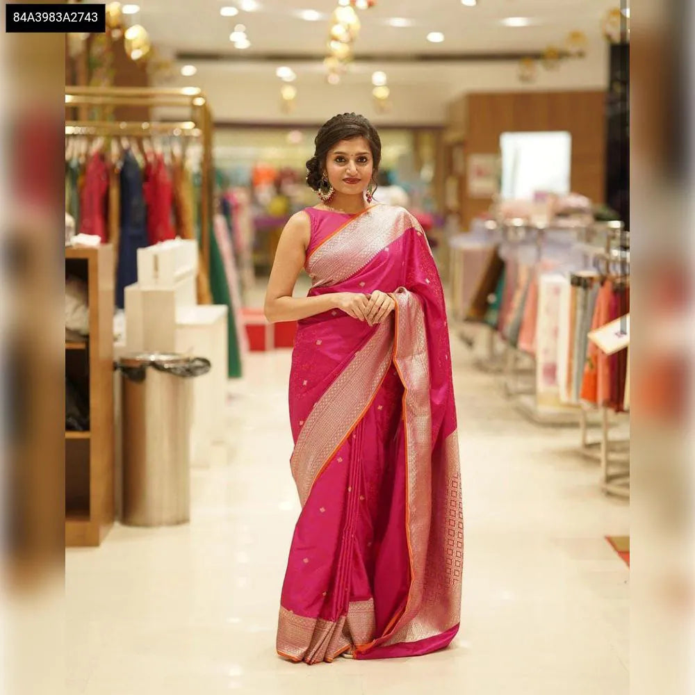 Full length shot of a woman in a vibrant Hot Pink Lichi Silk Saree, showcasing its rich pallu and graceful drape.