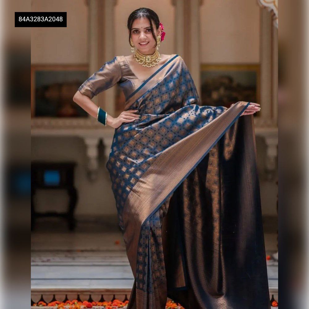 Elegant Navy Blue Lichi Silk Saree with Jacquard work, worn by a front-facing model in a traditional setting.