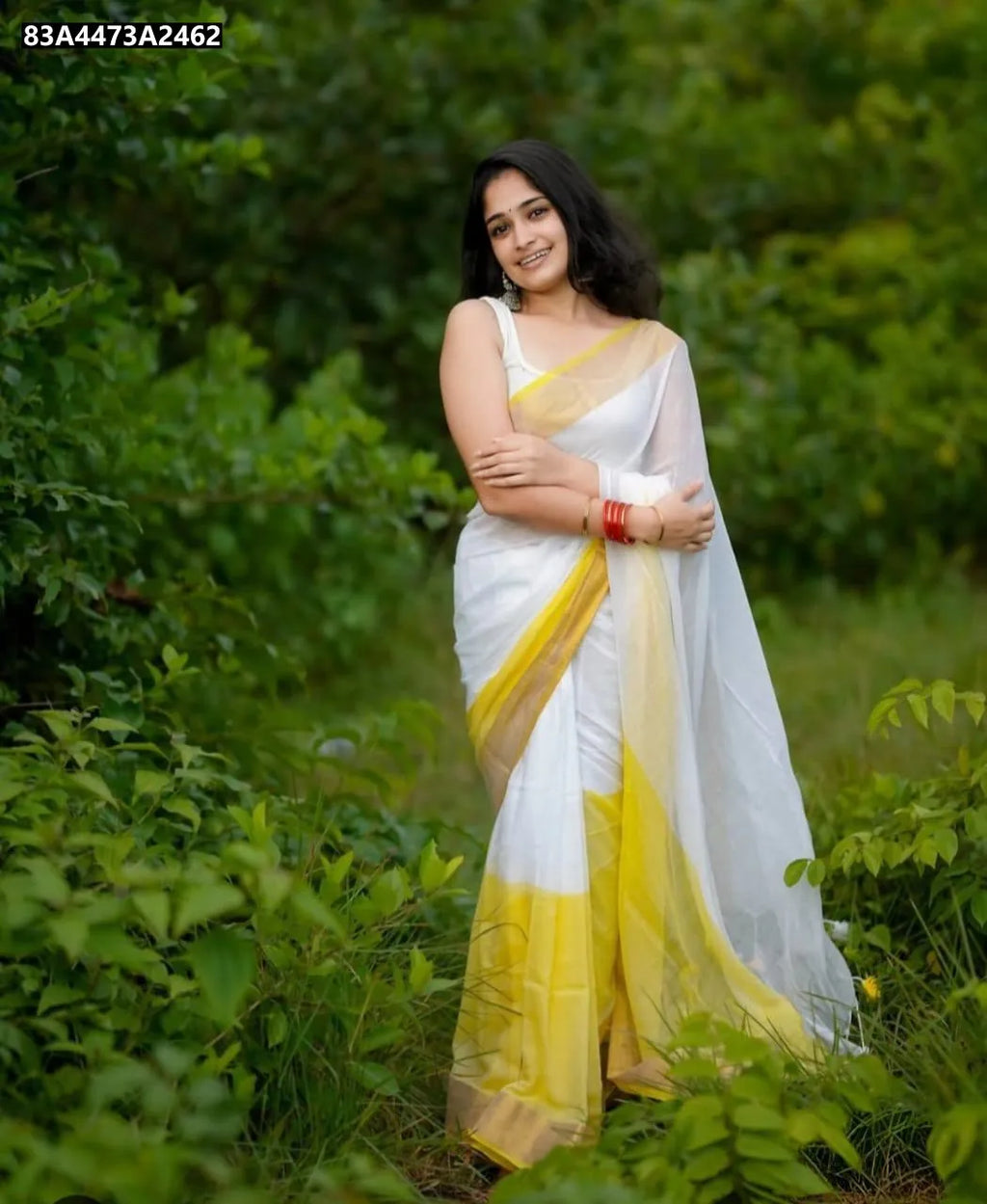 TRENDBUY White Linen Saree with bright yellow border and pallu, model smiling in a garden.