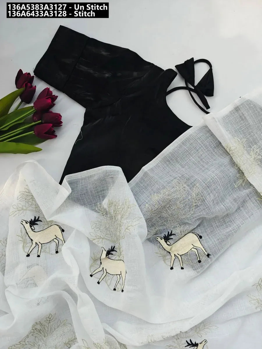 Flat lay of white pure linen embroidered saree with a black fancy silky unstitched blouse piece and red flowers