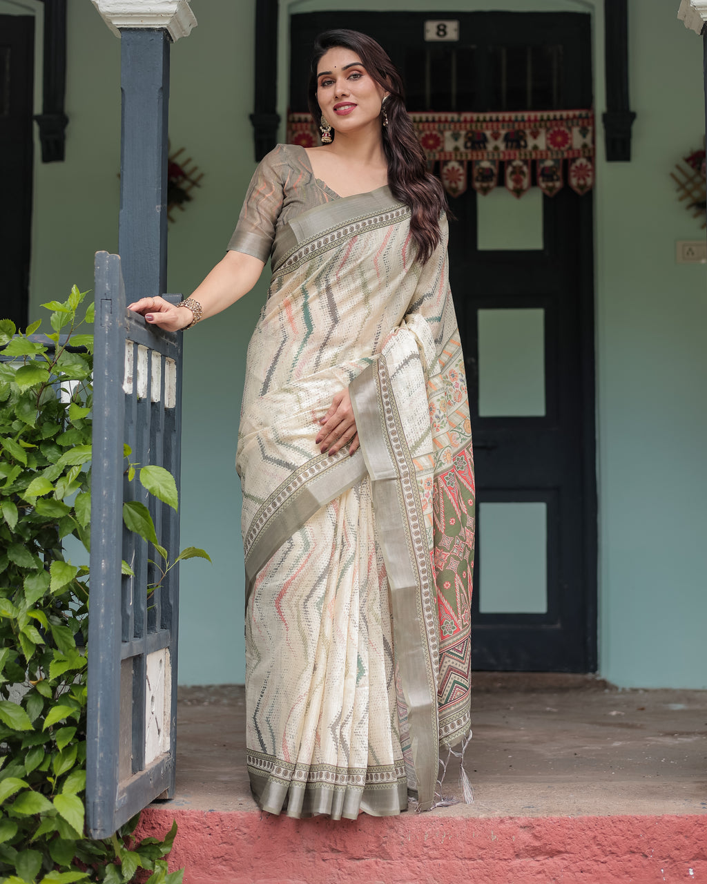 Woman posing in a beautiful Pastel Green and Beige Linen Saree with intricate tribal and geometric patterns, front view.