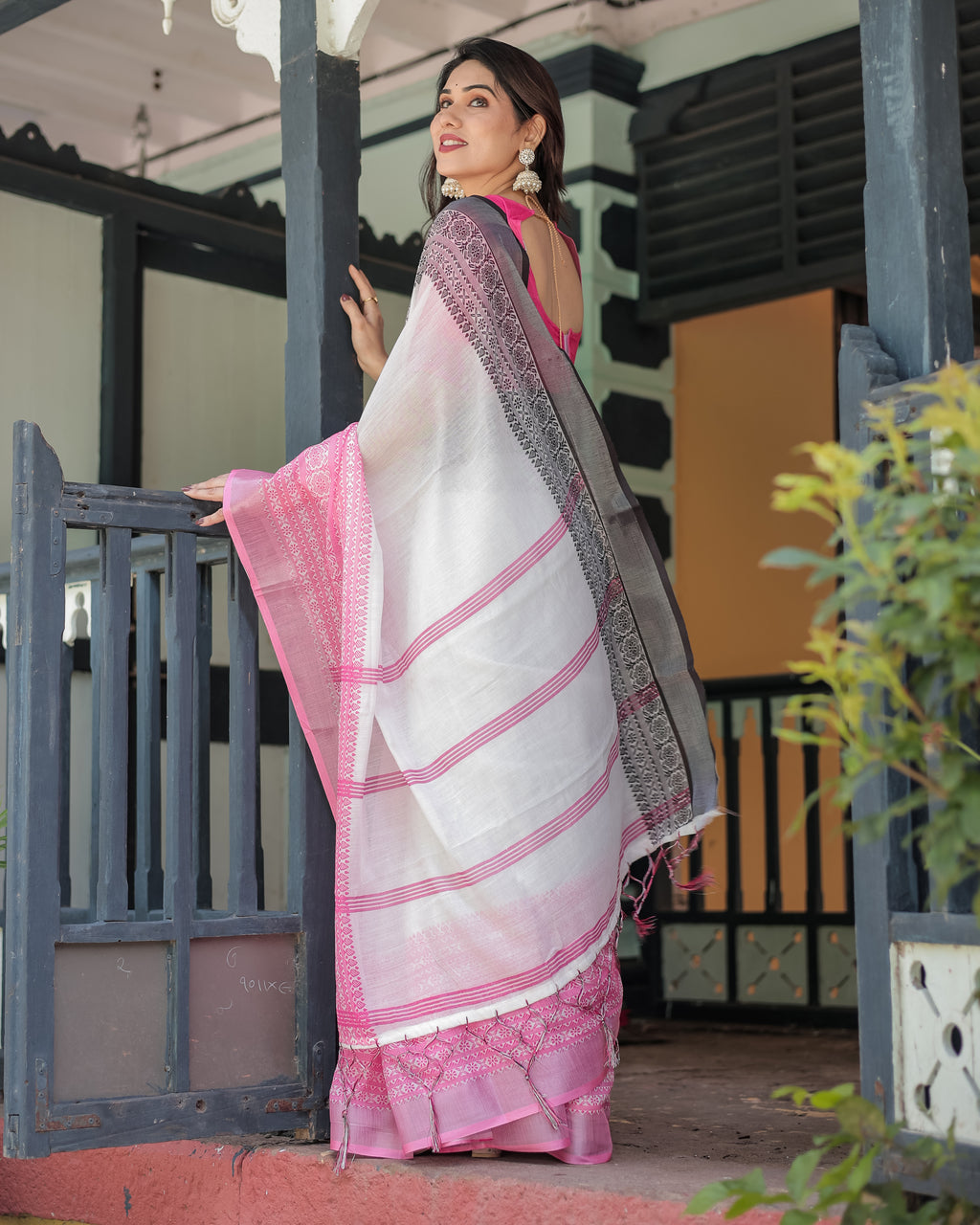 Close-up of the hot pink border with intricate black and pink floral woven motifs