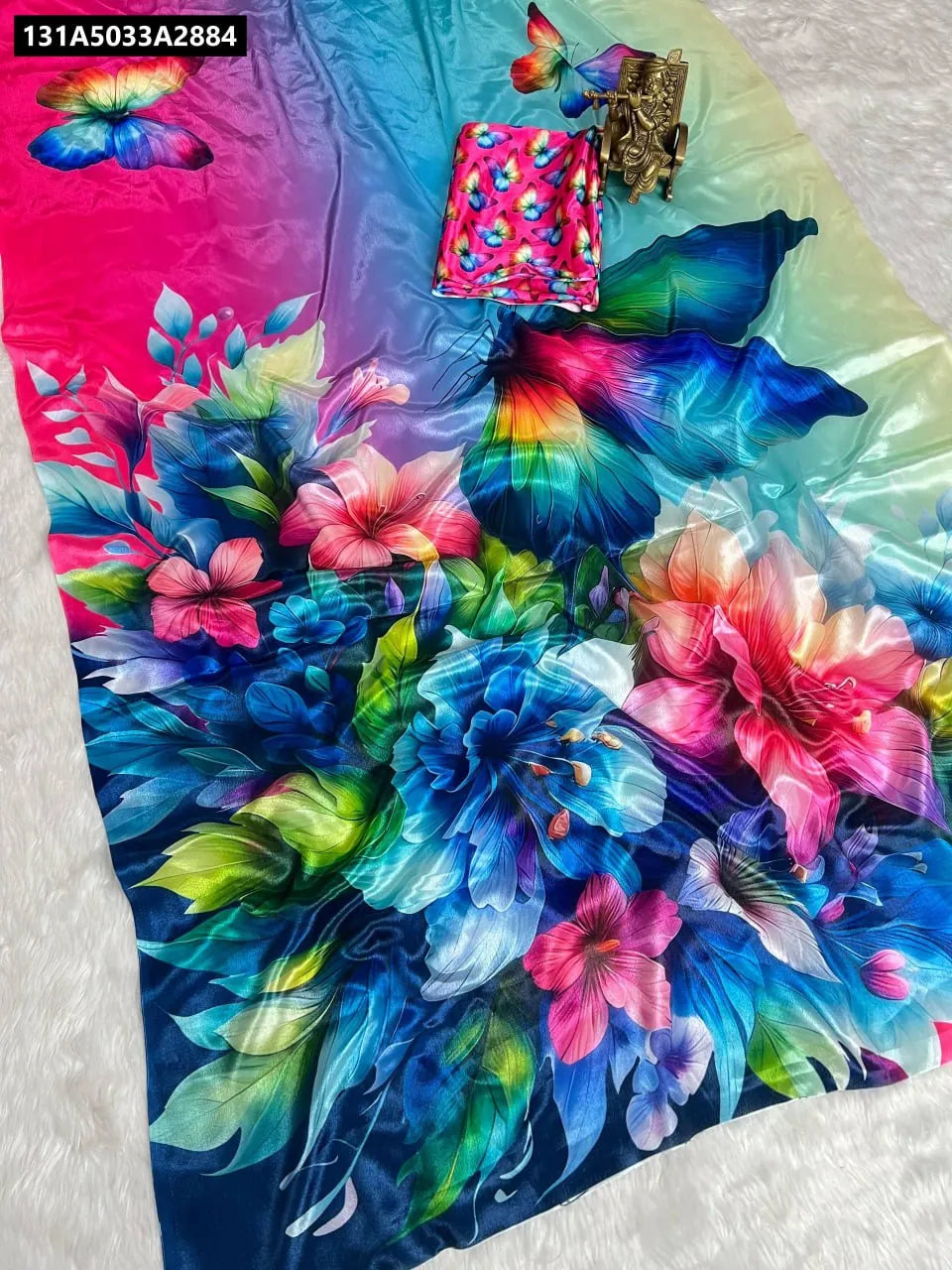 Vibrant multi-color Lustro Silk Saree with digital floral and butterfly print, showcasing the pallu and body with a matching blouse piece.