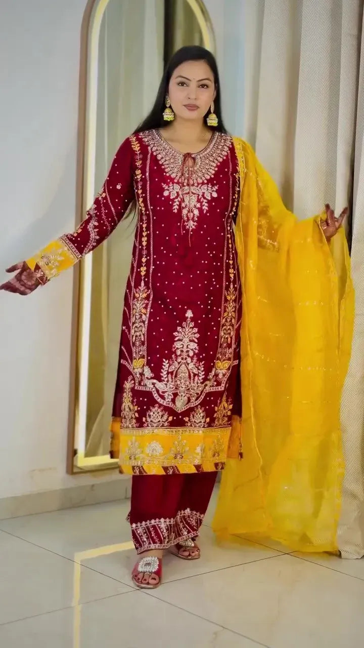 Full body front view of model in maroon and yellow chinon sharara suit