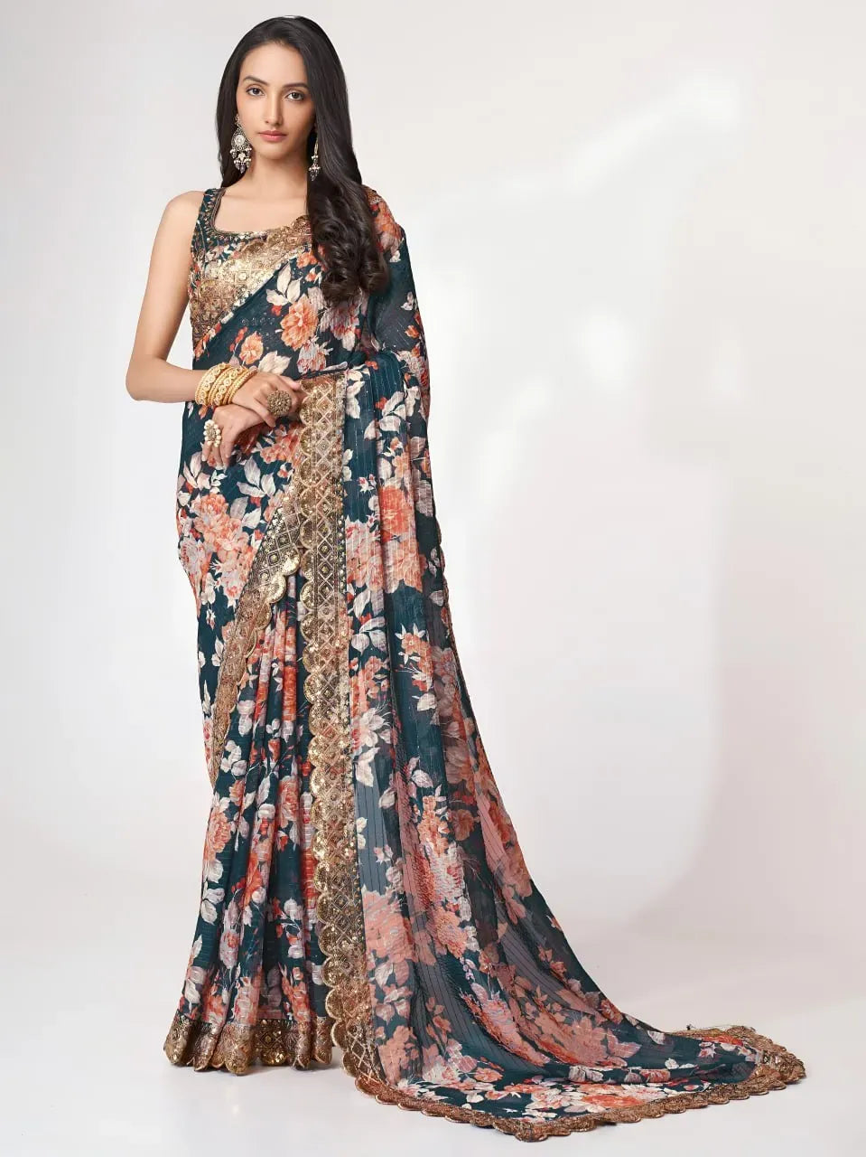 Model wearing dove blue floral organza saree with gold scalloped border