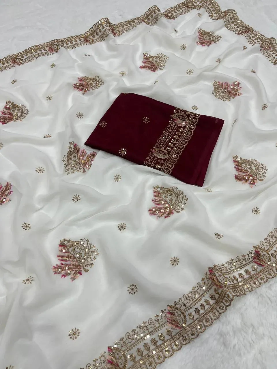 White star georgette saree with intricate zari and sequence work with matching unstitched blouse