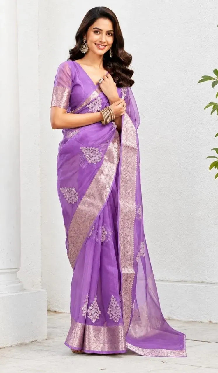 Model wearing lavender Kanchipuram organza saree with silver embroidery