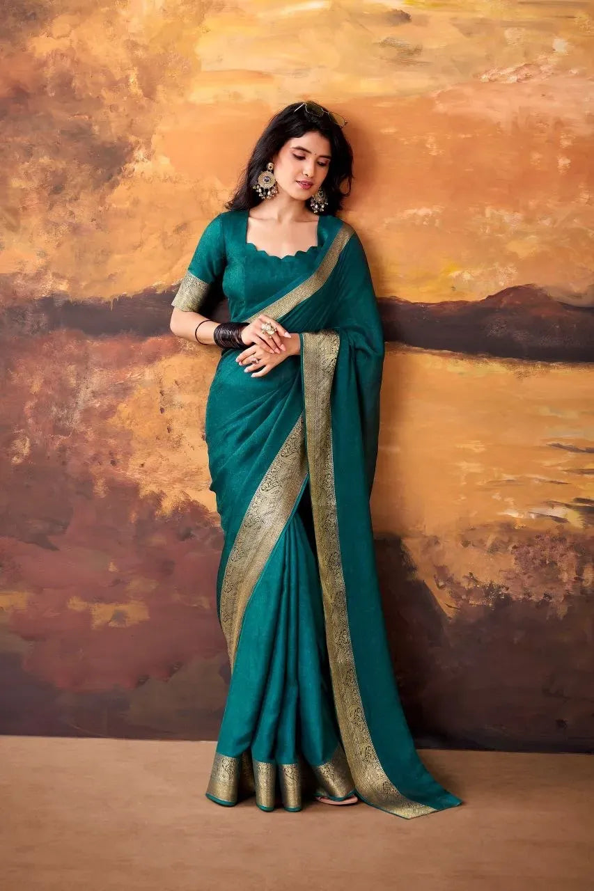 Full body view of model in teal green zari weaving festive saree
