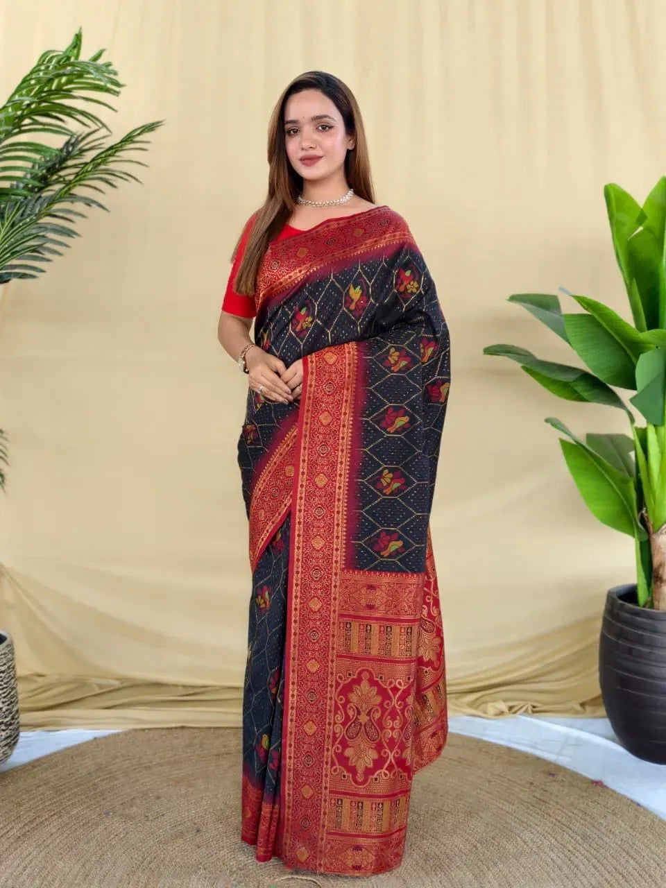 Black and red kanjivaram silk saree with zari woven pallu on model