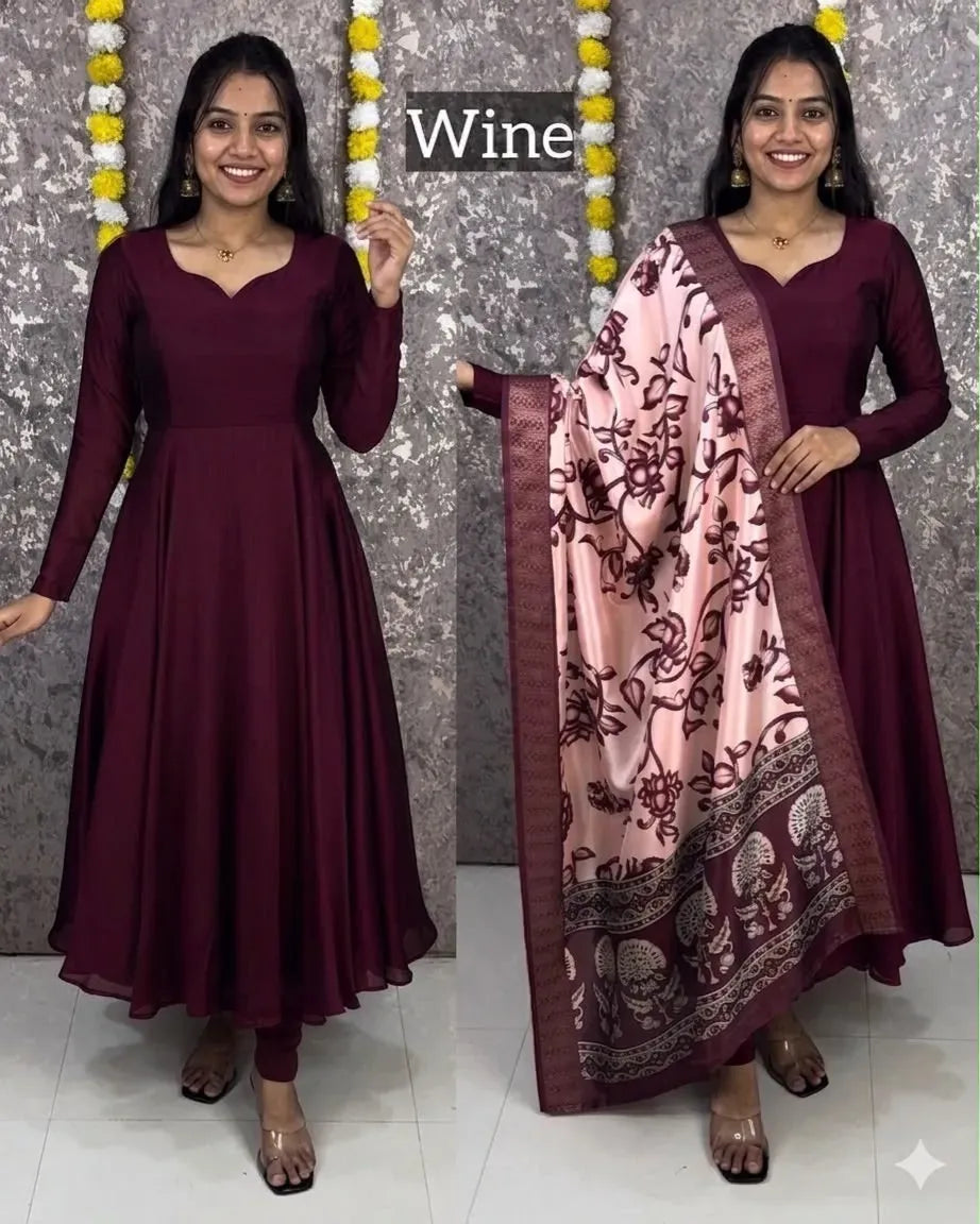 Model wearing wine silk anarkali dress with printed dupatta