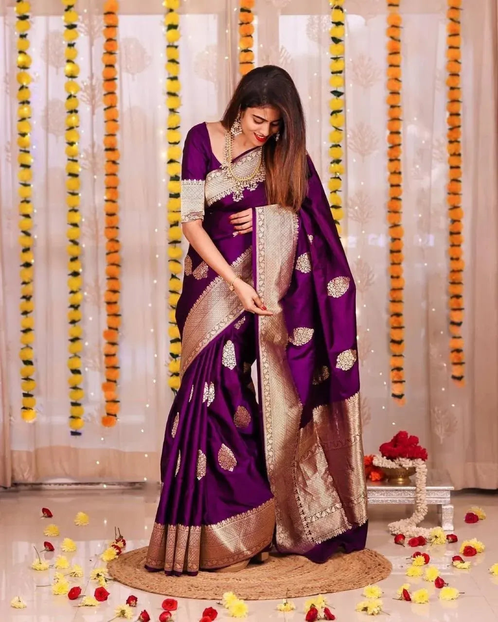 Model wearing purple lichi silk saree with rich jacquard pallu