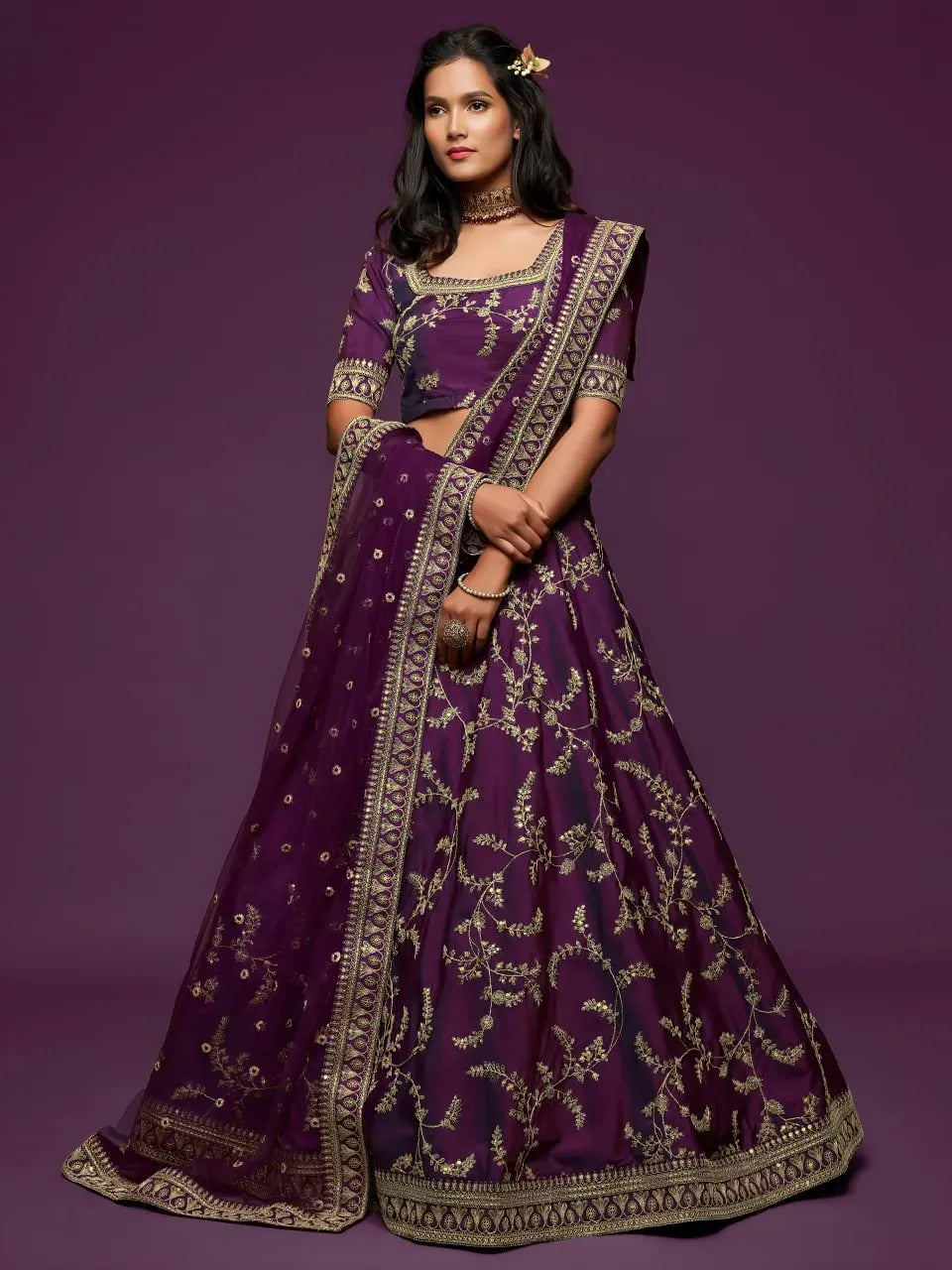Model wearing royal purple embroidered lehenga choli with dupatta front view