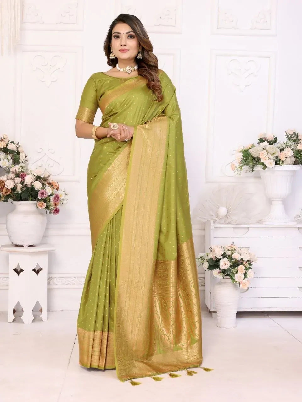 Full length view of model in olive green soft silk saree