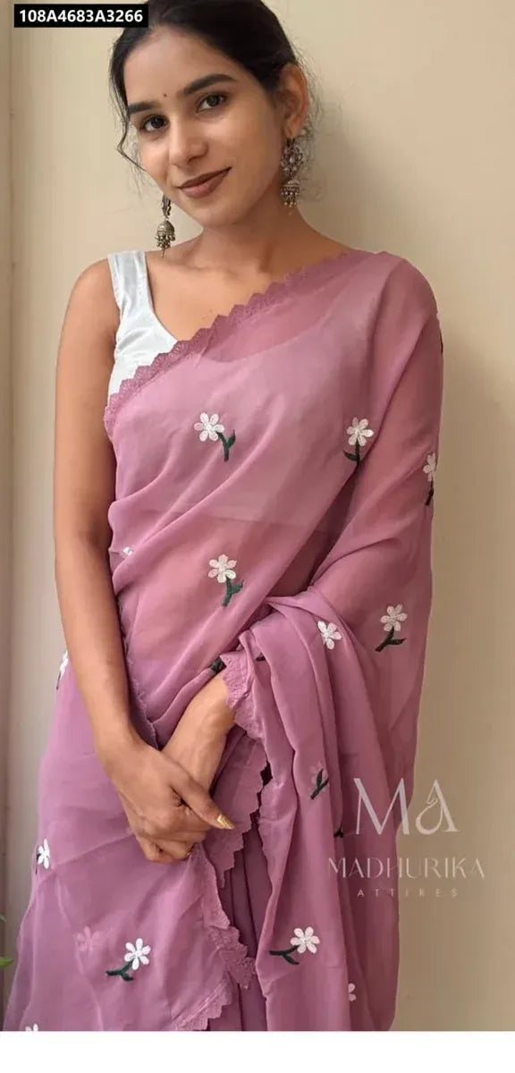 Model wearing a lavender Magic Georgette Designer Saree with white floral thread work and a silver blouse, looking elegant and front-facing.