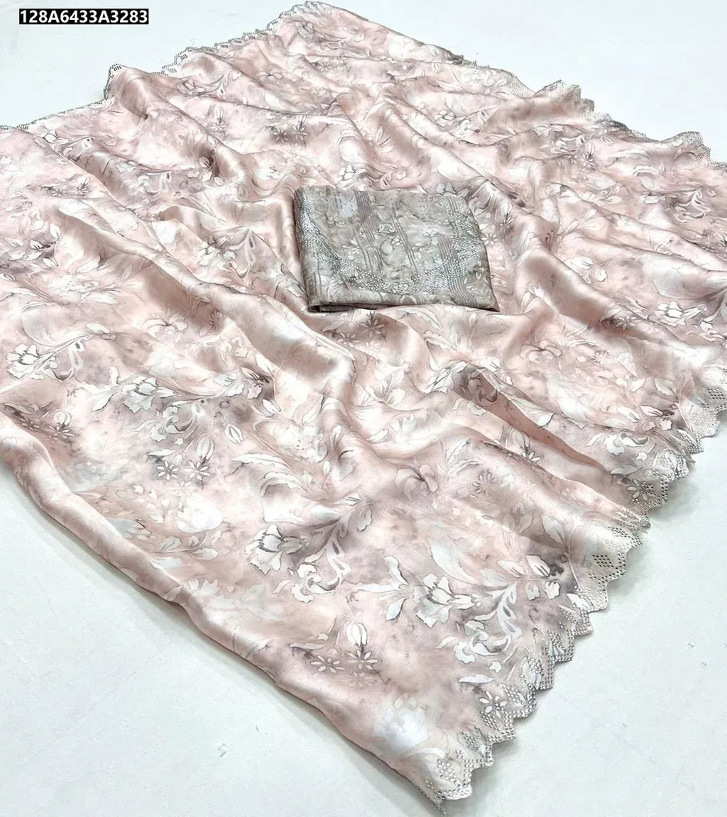 TRENDBUY Pure Maheshwari Silk Saree with cut work and diamond accents, featuring a muted peach floral print and matching blouse piece. Flat lay.