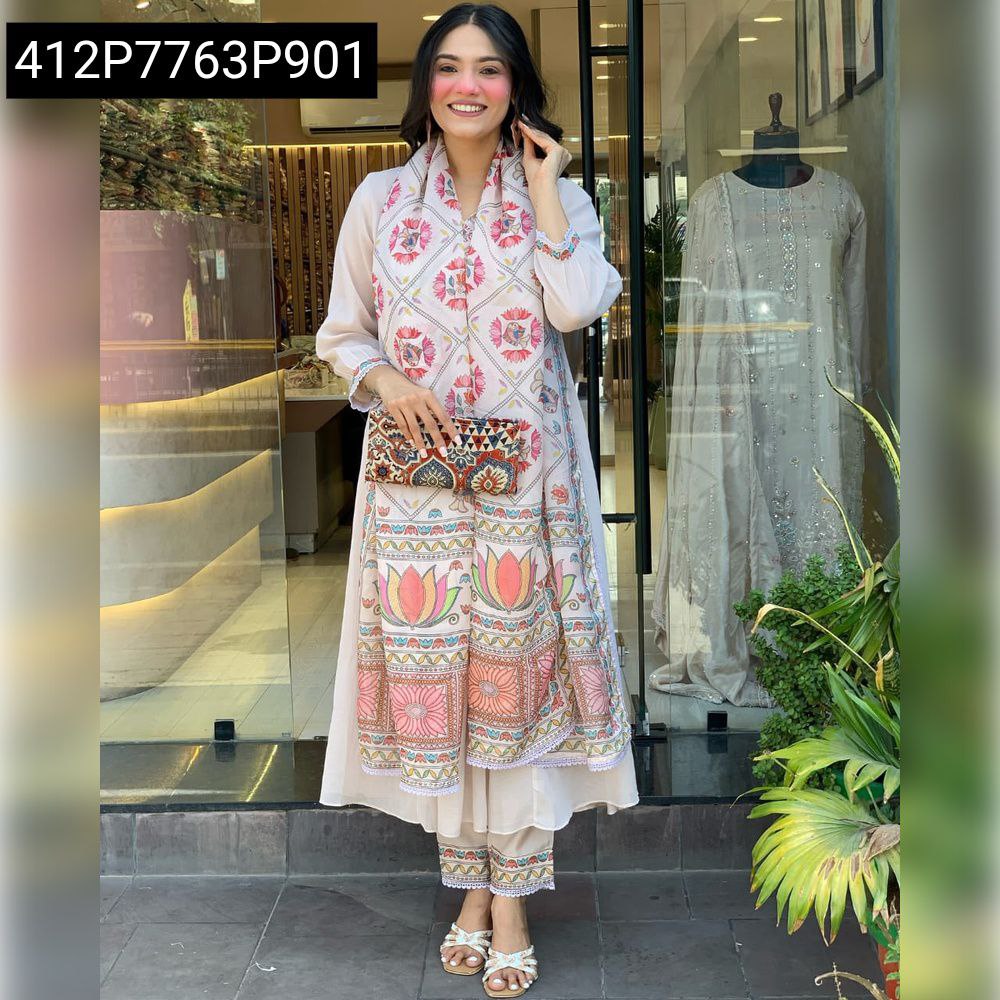 Full body shot of a model posing in a light peach Mul Chanderi 3-piece kurta set with a floral printed dupatta draped as a scarf.