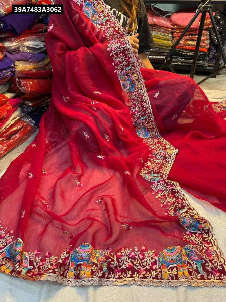 Woman wearing Maroon Multi-Embroidered Saree with elephant motifs, showing drape.
