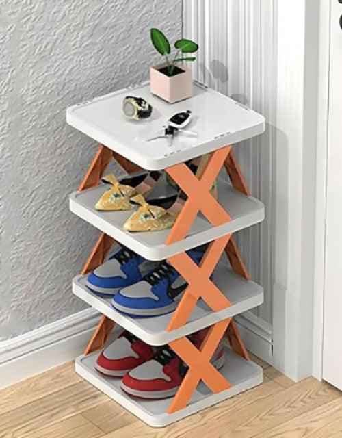 Multi-purpose stackable shoe rack with adjustable slots, neatly organizing various pairs of shoes.
