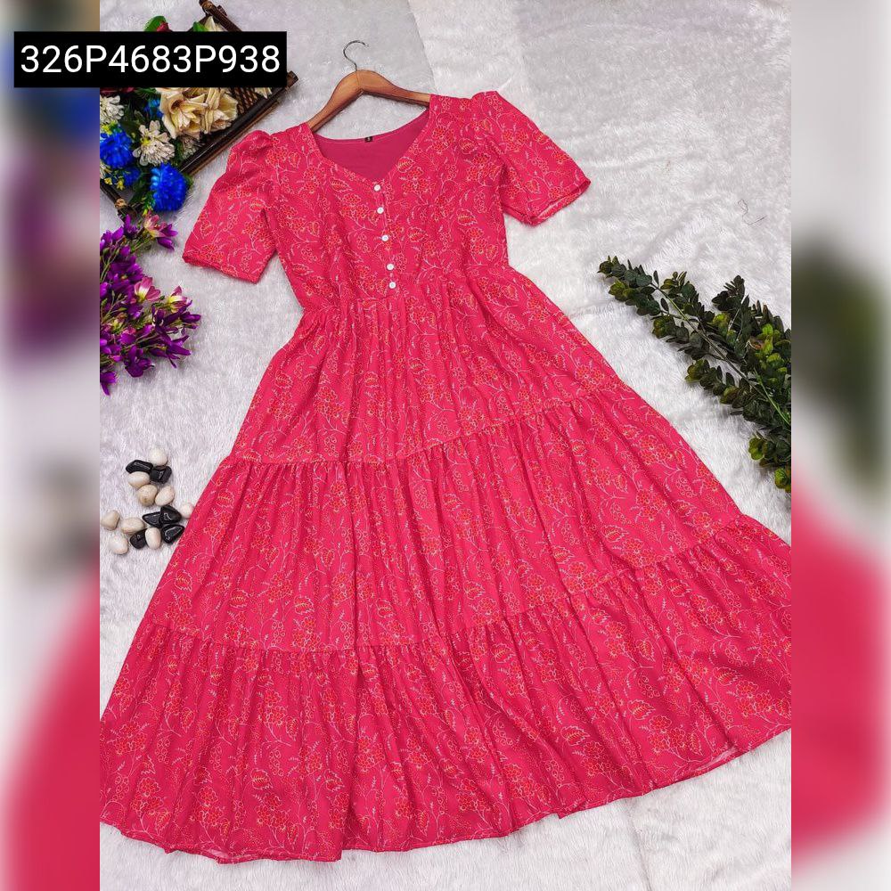 Pink Muslin Floral Tiered Dress on hanger with decorative items