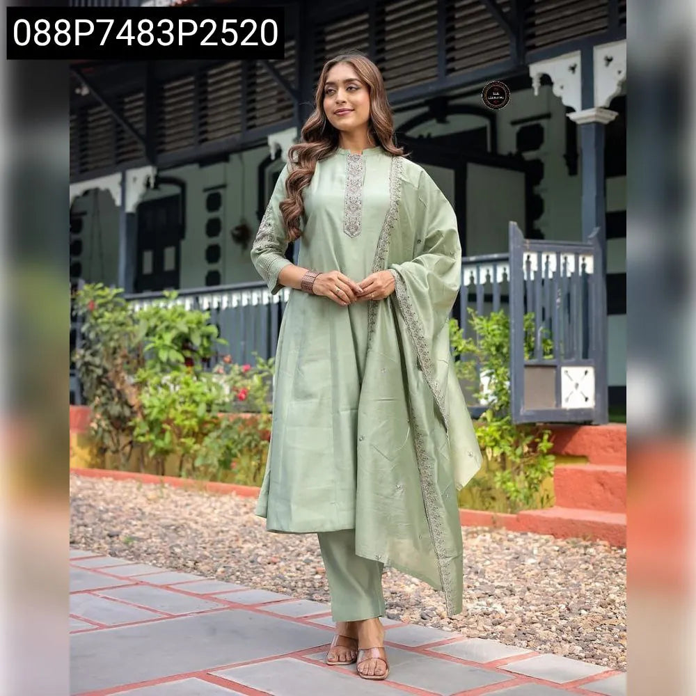 TRENDBUY Muslin Silk Anarkali Suit Set in Sage Green with intricate embroidery, worn by a model in a full front pose.