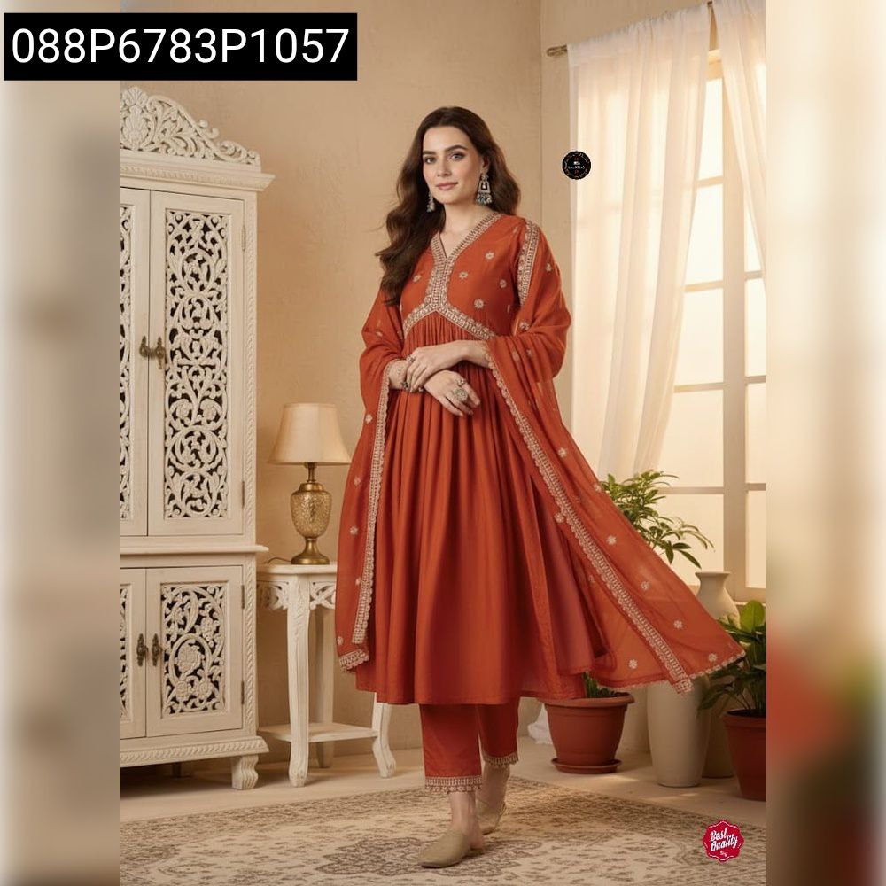 Full body model shot, front-facing, wearing a rust orange embroidered muslin silk kurti set with dupatta.