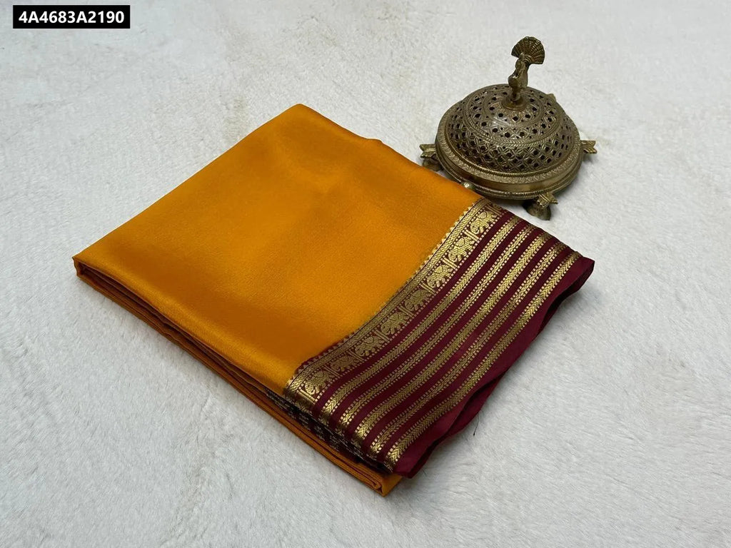 Folded Mustard Yellow Mysore Crape Silk Saree with Maroon and gold fancy elephant border