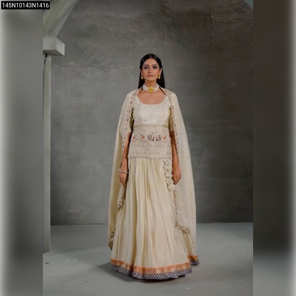 Model wearing Off-white Chinon embroidered lehenga set, front view, full body