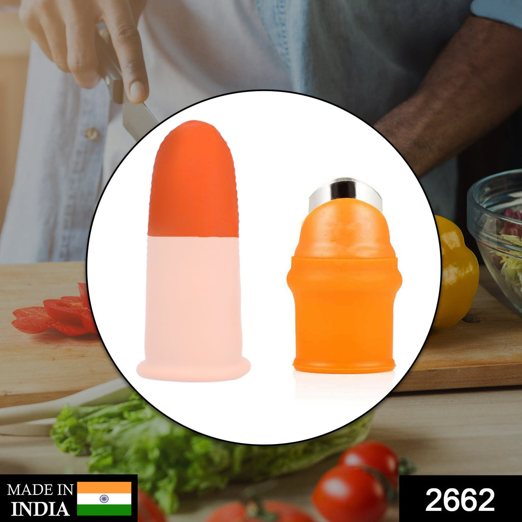 Person wearing a red silicone thumb cutter with a sharp blade for vegetables and fruits.