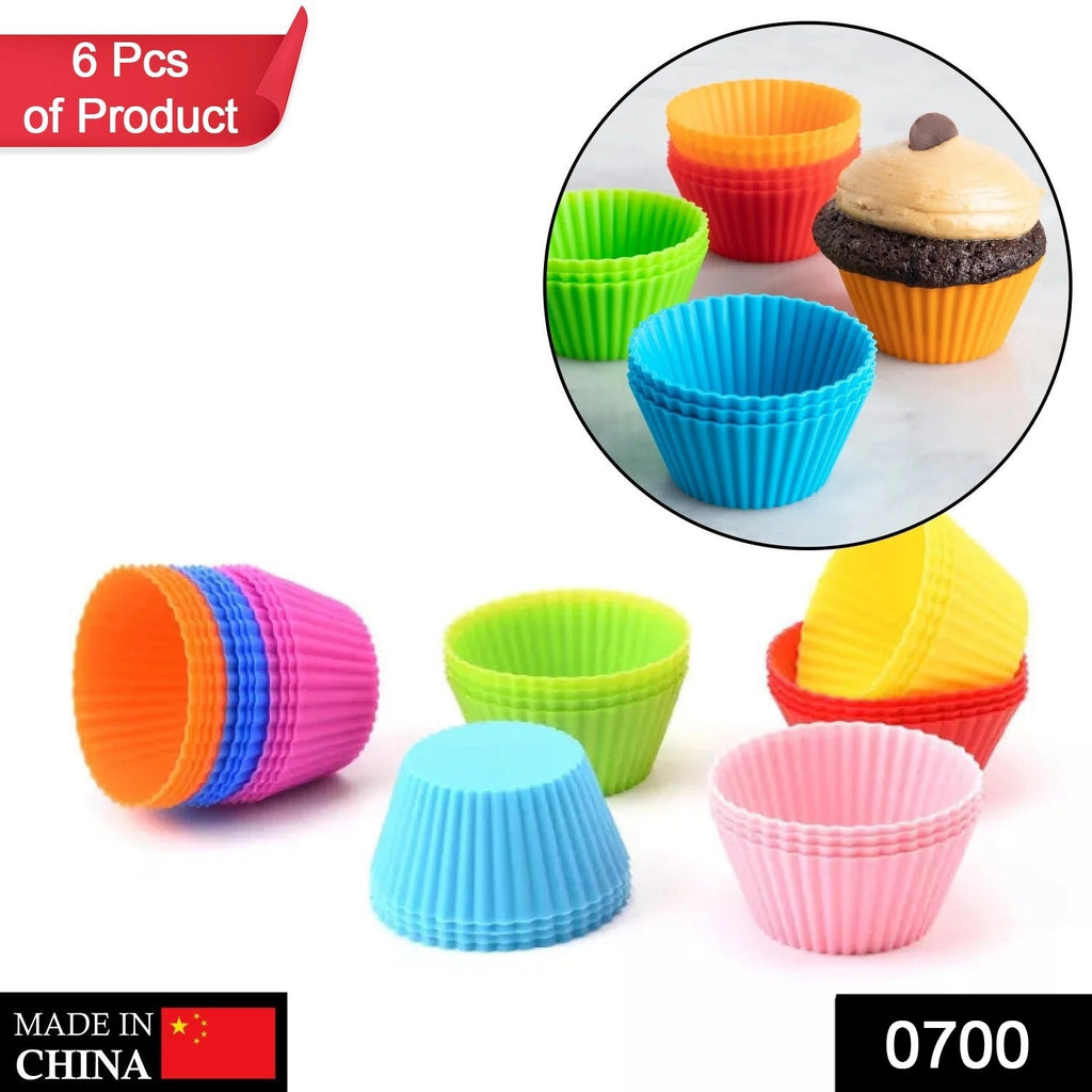 Pink silicone cupcake shaped baking mold for fondant, chocolate, candy, pastry, or soap.