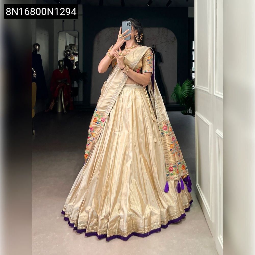 Woman in Cream Paithani Zari Weaving Lehenga Choli with Violet border and tassels