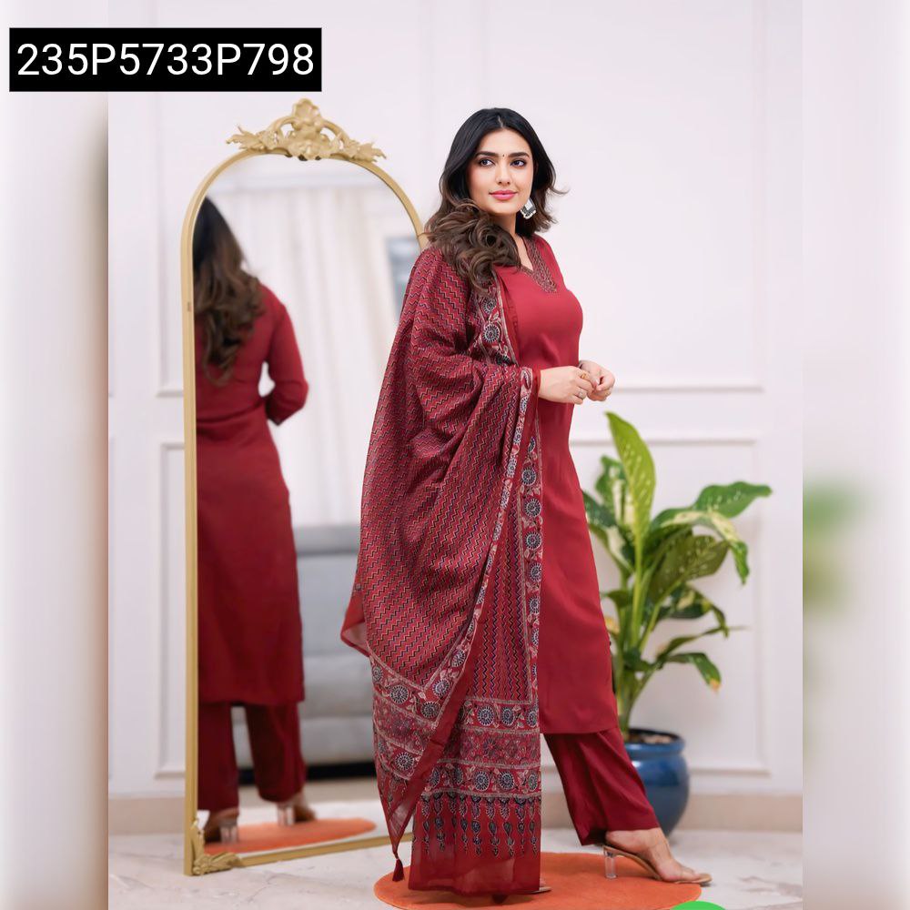 Full body shot of model posing, showing maroon Parampara silk suit with printed dupatta and sequence embroidery.