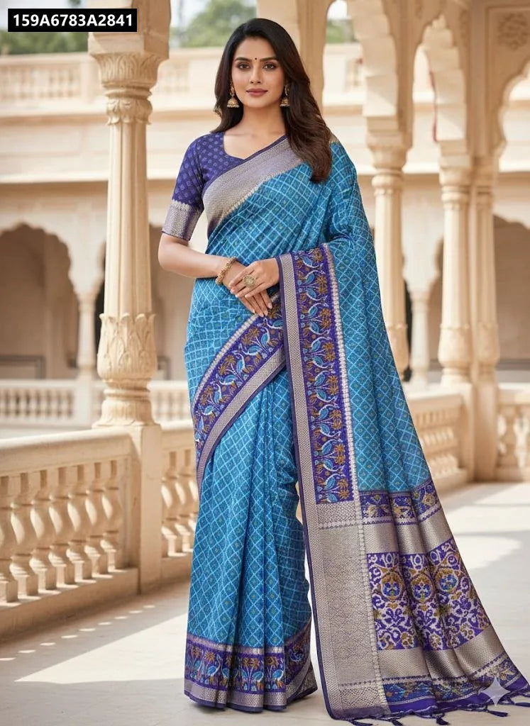 Elegant model wearing a TRENDBUY Sky Blue Patola Silk Saree with Gadwal border, posing gracefully.