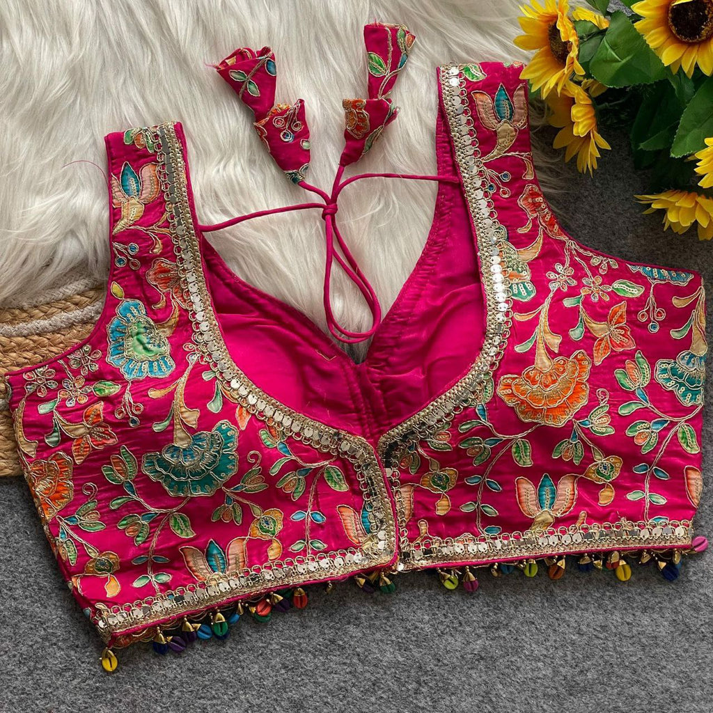 Hot Pink Floral Embroidered Readymade Blouse with mirror work and colorful tassels, front view.