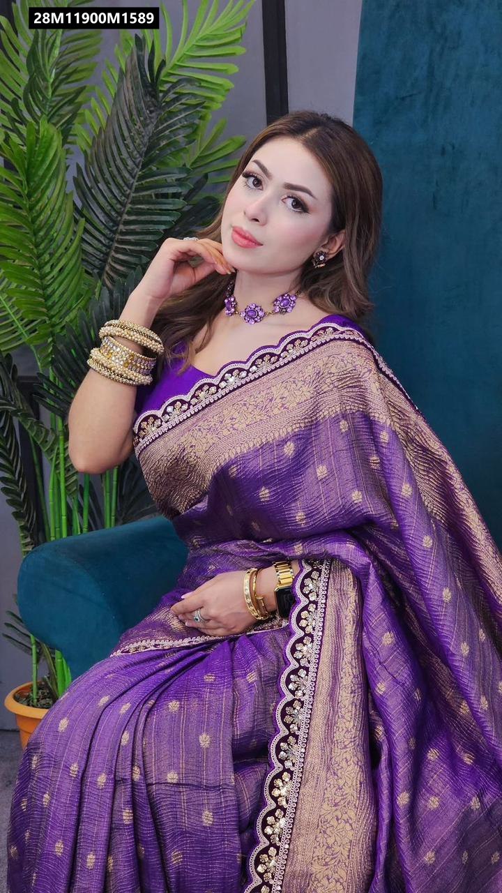 A woman draped in a vibrant purple Banarasi silk saree with gold zari weaving, posing gracefully.