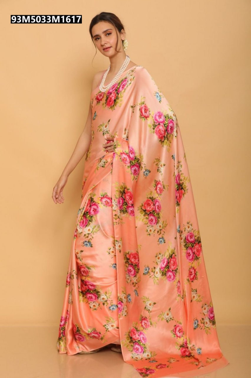 Model wearing a peach-colored Heavy Japan Satin saree with a vibrant floral print.