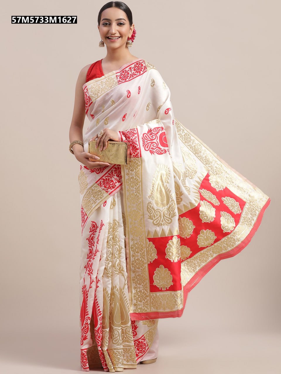 Close-up of intricate gold zari embroidery on the border